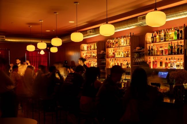 Nelson Kazan opened Pocket Change above Gratiot with a red neon sign and a third-floor patio